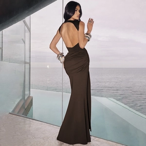 Detail of deep brown backless maxi dress featuring ruched waist and elegant fishtail hemline