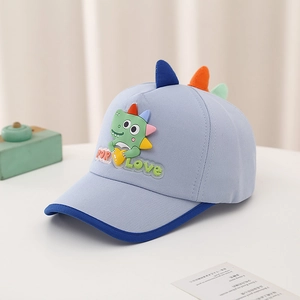 Detail of light blue toddler baseball cap with cartoon dinosaur and 3D triangle accents