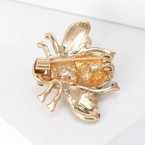 Macro shot of the gold alloy bee brooch back showing the pin closure and secure structure