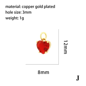 Detail view of red heart pendant in gold plated copper with 12mm x 8mm dimensions