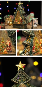 Detailed views of a festive Christmas tree snow globe with Santa and swirling glitter
