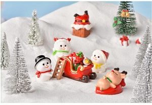 Miniature Christmas resin figurines set featuring snowmen and reindeer in snow