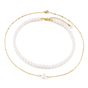 Double-layered titanium steel necklace with white pearls and gold chain on white background