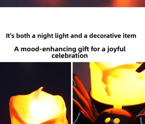 Detail of Halloween spider LED candle light with glowing orange electronic flame wick