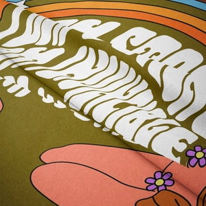 Close-up of retro pop art tapestry showing fiber texture and rainbow stripe details