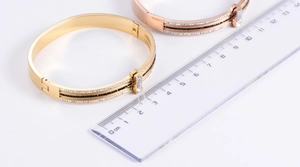 Detailed size reference for gold and rose gold crystal bangles with rectangular stone
