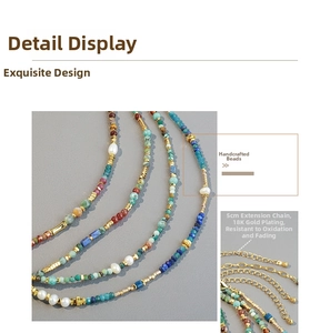 Detail of handmade beaded necklace with 18K gold plated clasp and adjustable extension chain