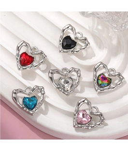 Detail of colorful heart-shaped crystal charms with silver-plated alloy frames for DIY