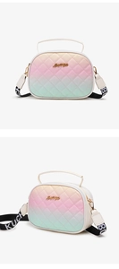 Detailed macro view of gradient quilted crossbody bag with stylish letter strap and gold logo