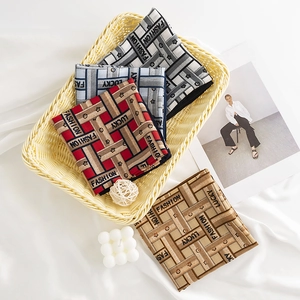 Silk-like square scarves with Fashion Lucky print in a basket for a trendy commute style