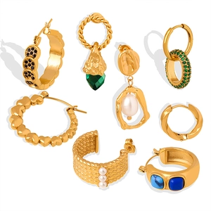 Collection of gold titanium steel earrings featuring vintage textures and pearl charms