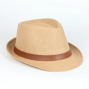 Detail of the woven texture and dark brown leather band on the panama straw sun hat