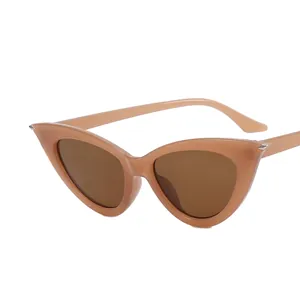 Vintage cat eye sunglasses in light brown frame with dark lenses and silver metal detail