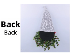 Detailed back view of a faceless gnome Christmas wreath with pine needles and red berries