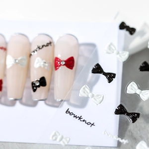 3D bowknot nail art stickers in various colors with rhinestones on nude long nails