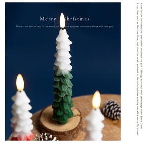 Three LED Christmas tree candles on a wooden base with warm light and pine cones decor