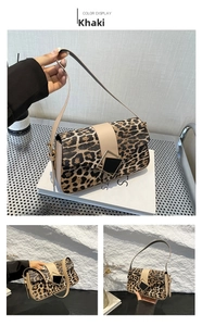 Detail of leopard print shoulder bag featuring square metal clasp and khaki strap