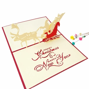Detailed 3D pop-up Christmas card featuring Santa's reindeer sleigh and festive laser cutouts