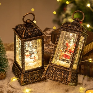 Vintage bronze Christmas snow globe lanterns with Santa, snowmen and warm LED lights