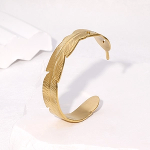 Elegant 18k gold plated stainless steel open cuff bracelet featuring leaf feather design