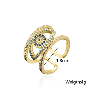 Exaggerated gold plated evil eye open ring with blue and white cubic zirconia