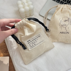 Minimalist cotton drawstring pouch with cartoon print for makeup and travel storage