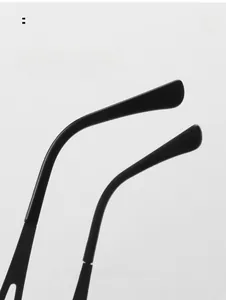 Detailed macro view of the comfortable nose pads and hinge design on black Y2K sunglasses