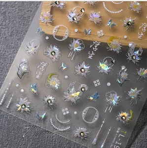 Detailed holographic 5D nail sticker with lotus, butterfly, and crescent moon patterns