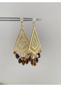 Detailed view of vintage gold hollow diamond-shaped earrings with zircon and tiger eye beads