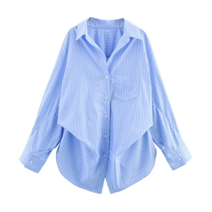 Detailed view of the blue and white striped shirt with lapel collar and single chest pocket