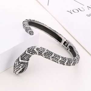 Detailed view of vintage snake-shaped stainless steel bracelet with textured scales