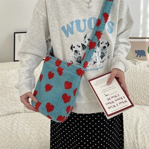 Detail of soft leopard print faux fur shoulder bag with red heart pattern texture