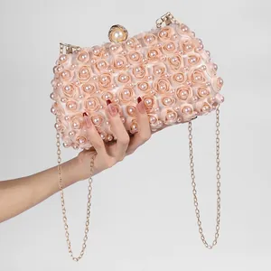 Champagne satin evening clutch bag with 3D roses, pearls, and gold chain strap