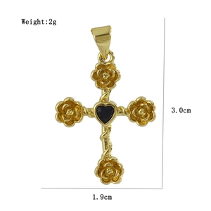 Detailed size view of gold cross pendant with rose decor and black heart gemstone