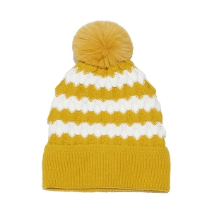 Detailed view of yellow and white striped knit beanie with a fluffy ginger pom-pom top