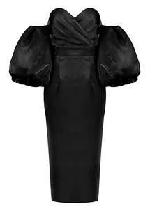 Detail of black off-shoulder cocktail dress with heart-shaped neckline and puff sleeves