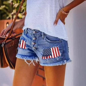 Women's high waist denim shorts with American flag patches and distressed fringed hem