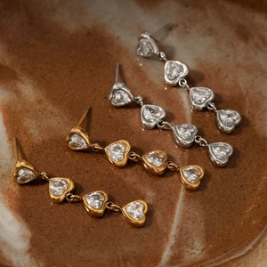 Elegant gold and silver heart-shaped stainless steel drop earrings with zircon crystals
