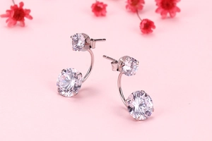 Macro shot of S925 sterling silver earrings with dual round cut cubic zirconia stones