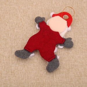Rear view of handmade fabric Santa ornament showing smooth stitching and gold lanyard