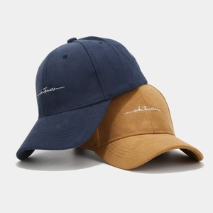Navy blue and camel suede baseball caps with white 'whatever' embroidery set