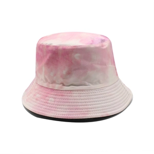Detailed view of pink tie-dye cotton bucket hat with reinforced stitching on the brim