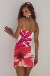 Rear view of white strapless bodycon dress with bold pink floral print and slim fit