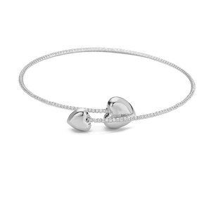 Detailed macro of silver-plated bracelet featuring double heart pendants and pavé zircon stones