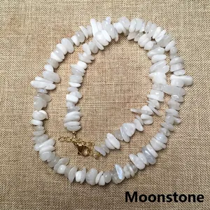 Close-up of natural moonstone chip necklace with a gold lobster clasp and extension chain