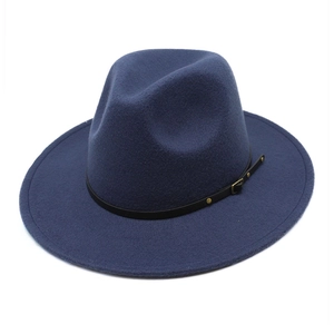 Detail view of a navy wool fedora hat featuring a black leather band and gold buckle