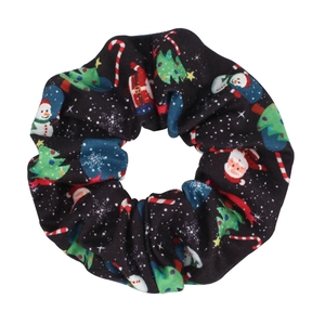 Close-up of black Christmas scrunchie with snowman, candy cane and tree patterns