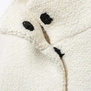 Elegant white wool blend cape coat featuring a high collar and black decorative buttons