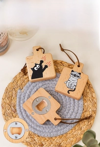 Detail of wooden cat claw bottle openers with magnets and leather hanging straps