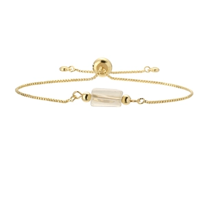 Detail of adjustable gold box chain bracelet featuring a clear hexagonal stone charm